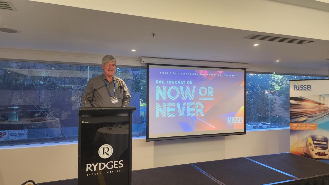 4Tel Founder Derel Wust presenting on stage at the conference