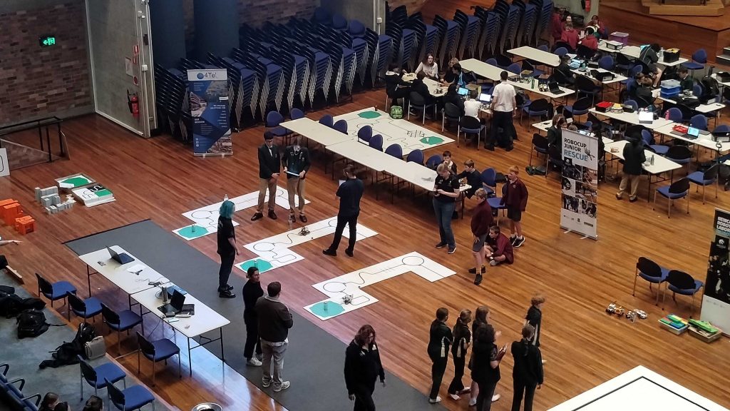 Perspective view of the RoboCup Junior competition inside the University of Newcastle's Great Hall.
