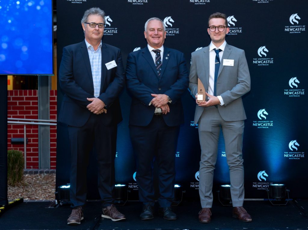 CEO Tony Crosby and Marketing Executive Josh Kostic accept 4Tel's award presented by University of Newcastle Vice Chancellor Alex Zelinsky.